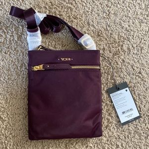 Tumi purple Cassandra mini pocket bag